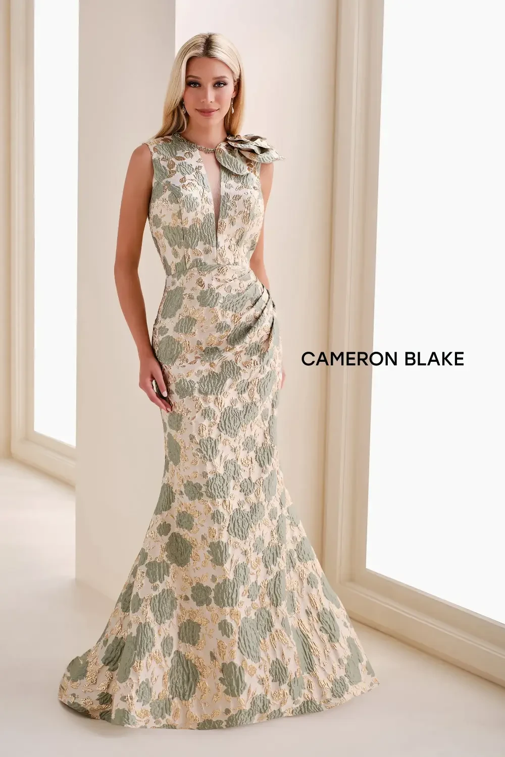 A woman in a floral evening gown stands gracefully in front of a light background, with the text 